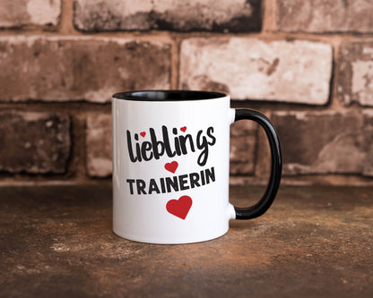 Lieblingstrainerin | Dankeschön Tasse | Sport Trainerin Tasse Weiß - Schwarz - Kaffeetasse / Geschenk / Familie