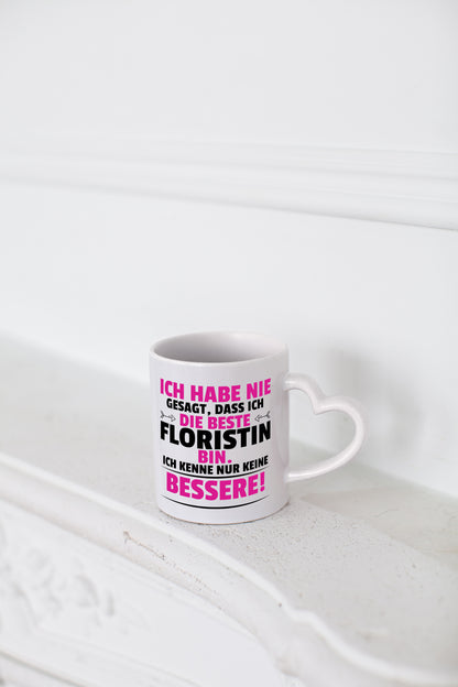 Die Beste Floristin | Blumen Verkäuferin - Herzhenkel Tasse - Kaffeetasse / Geschenk / Familie