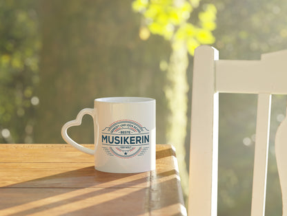 Geprüft und sicher: Musikerin | Musik | Musikantin - Herzhenkel Tasse - Kaffeetasse / Geschenk / Familie