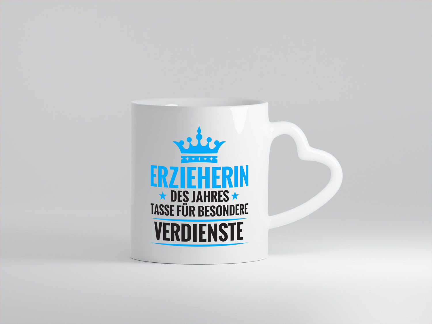 Besonderer Verdienst: Erzieherin | Pädagogin | Schule - Herzhenkel Tasse - Kaffeetasse / Geschenk / Familie