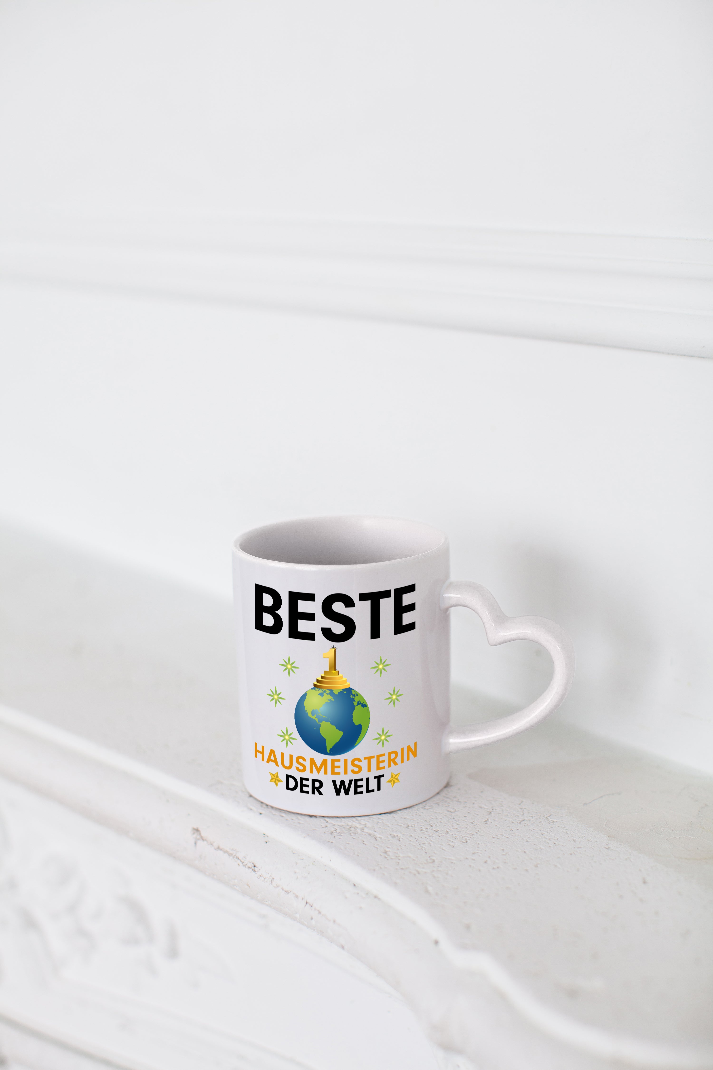 Welt Beste Hausmeisterin | Hauswart - Herzhenkel Tasse - Kaffeetasse / Geschenk / Familie