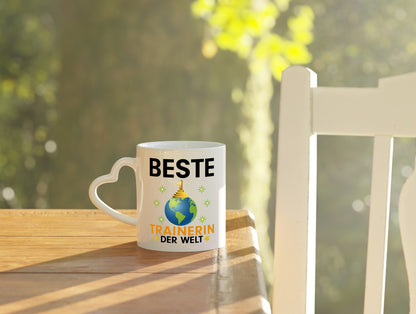 Welt Beste Trainerin | Sportverein | Humor - Herzhenkel Tasse - Kaffeetasse / Geschenk / Familie